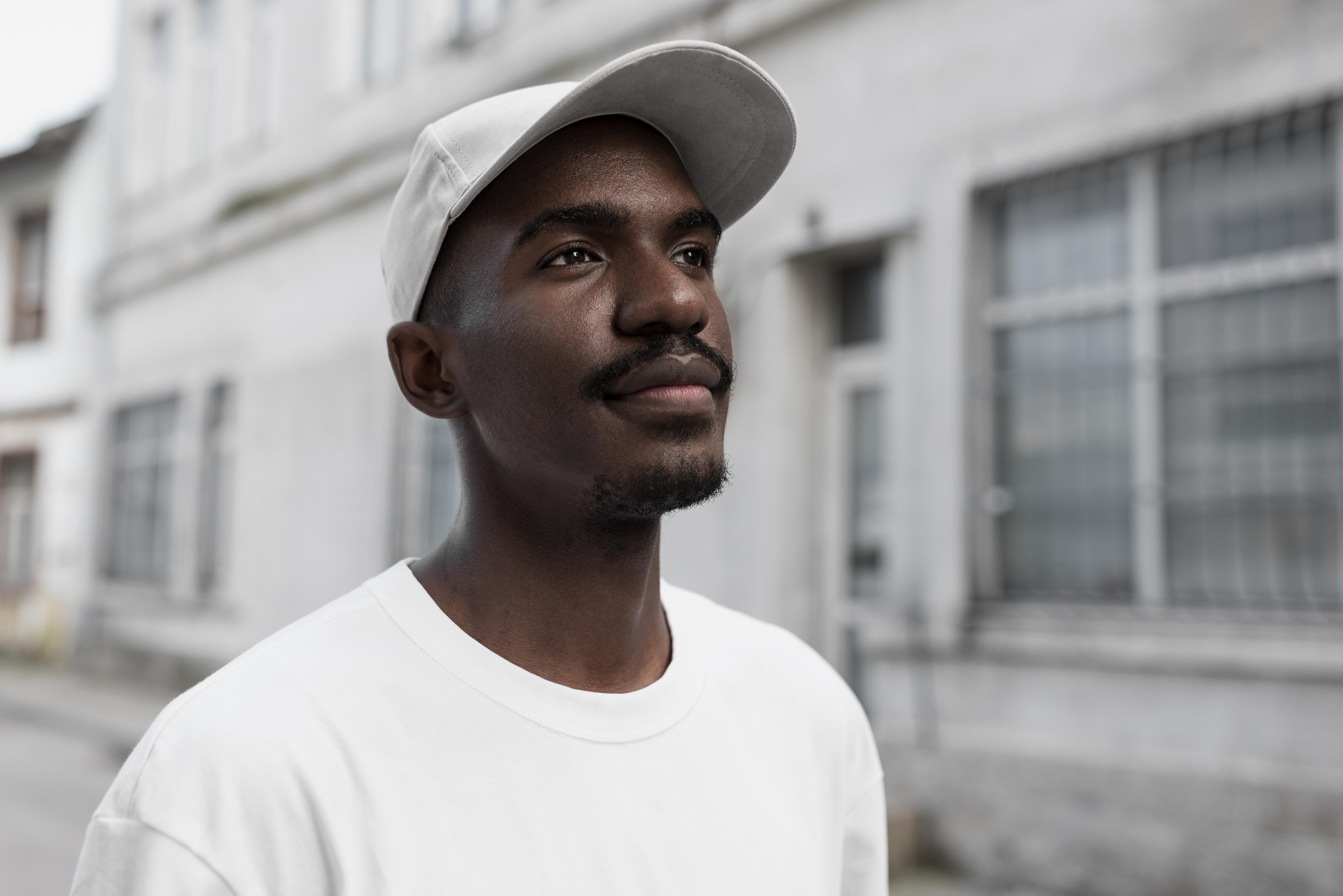 medium-shot-smiley-man-posing-outdoors